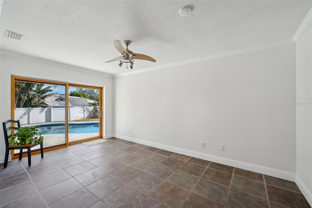 spare room featuring a textured ceiling, ornamental molding, and ceiling fan