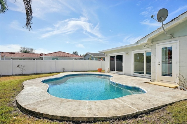 view of swimming pool with a patio area