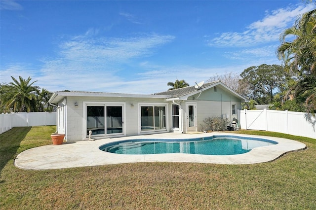 view of pool with a yard and a patio