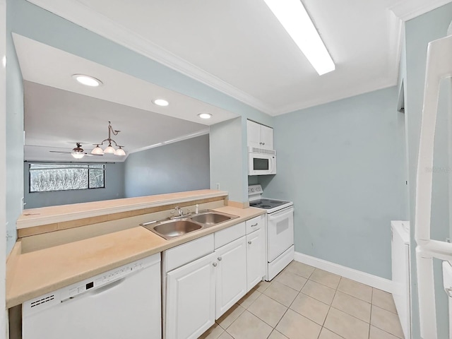 kitchen with white cabinetry, sink, white appliances, and ornamental molding