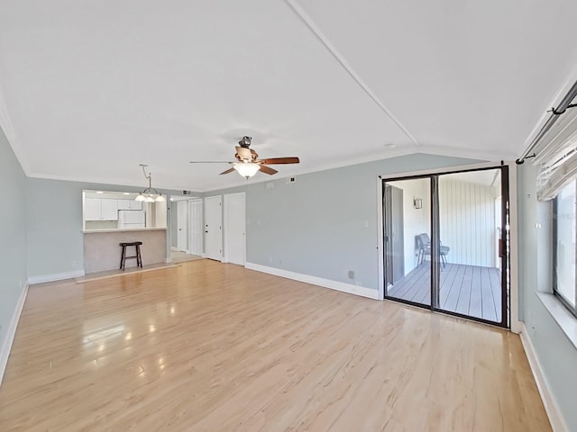 unfurnished living room featuring ceiling fan, lofted ceiling, light hardwood / wood-style flooring, and ornamental molding