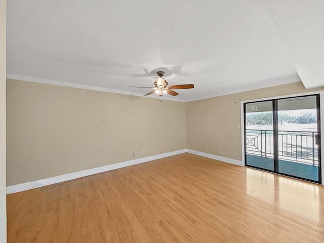 empty room with crown molding, ceiling fan, and light wood-type flooring