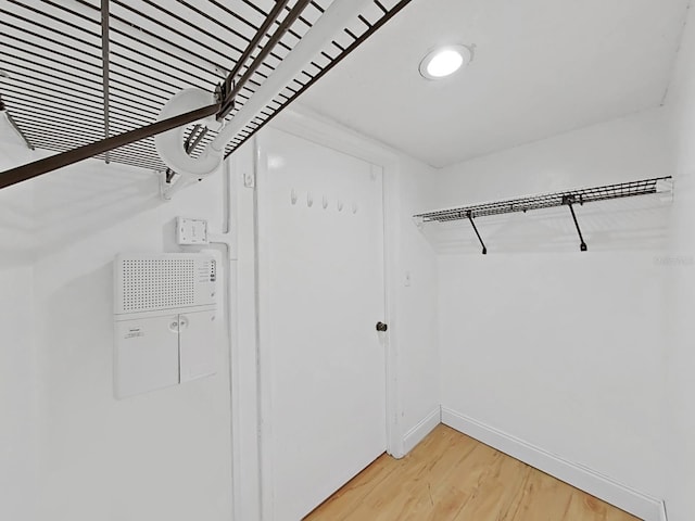 spacious closet featuring hardwood / wood-style floors