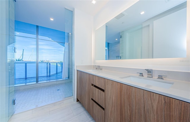 bathroom with vanity and an enclosed shower