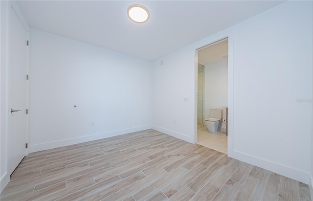 unfurnished room with light hardwood / wood-style floors