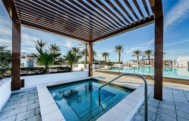 view of pool featuring a pergola, a hot tub, and a patio