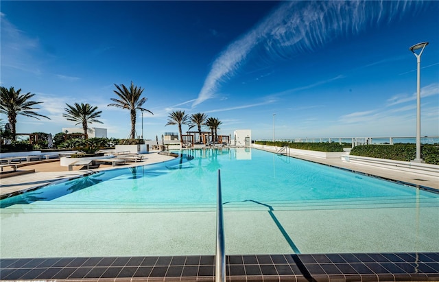 view of swimming pool with a patio area