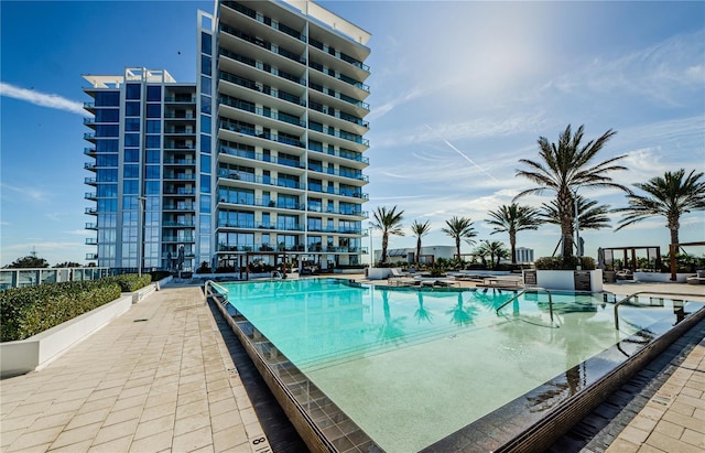 view of swimming pool featuring a patio