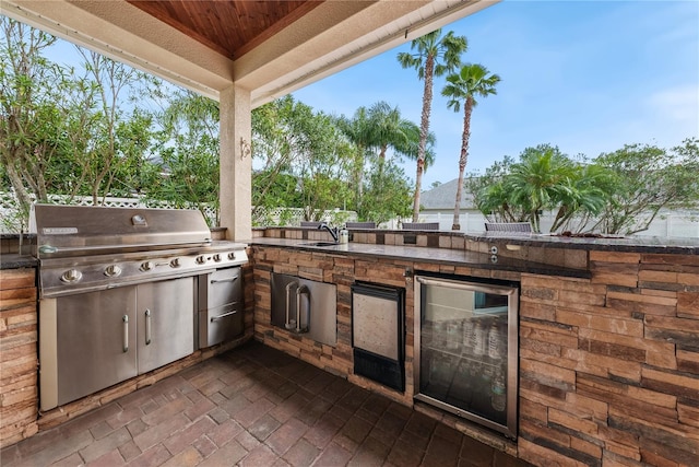 view of patio featuring area for grilling and an outdoor kitchen