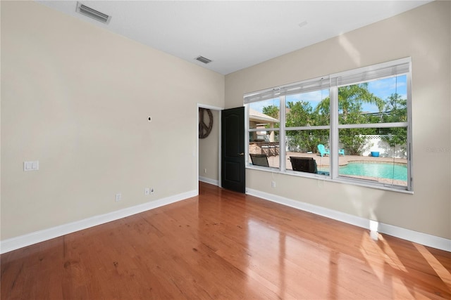 empty room featuring hardwood / wood-style floors