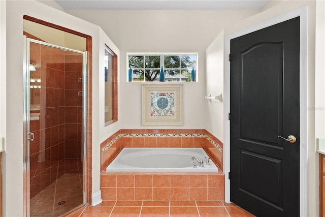 bathroom featuring separate shower and tub