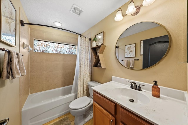 full bathroom with vanity, shower / tub combo, a textured ceiling, and toilet