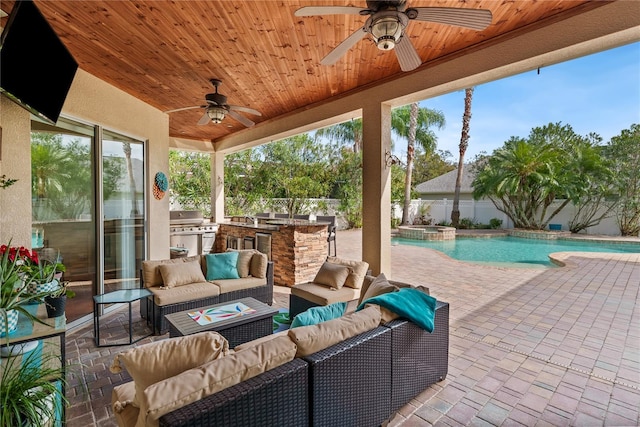 view of patio / terrace featuring area for grilling, an outdoor living space, a swimming pool with hot tub, and ceiling fan