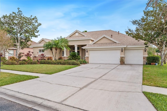 view of front of property with a garage and a front yard