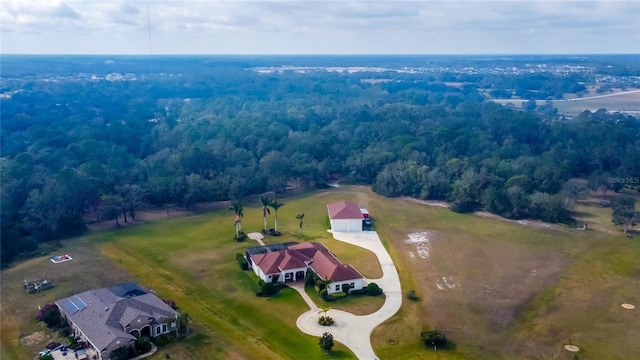 birds eye view of property with a rural view and a view of trees