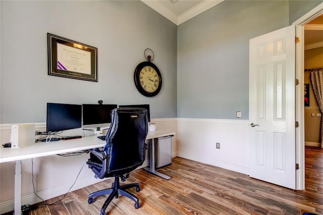 office with ornamental molding, wood finished floors, and baseboards