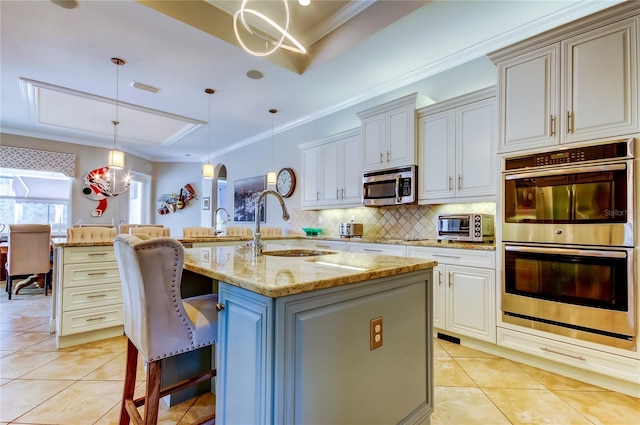 kitchen with appliances with stainless steel finishes, arched walkways, light tile patterned flooring, and decorative backsplash