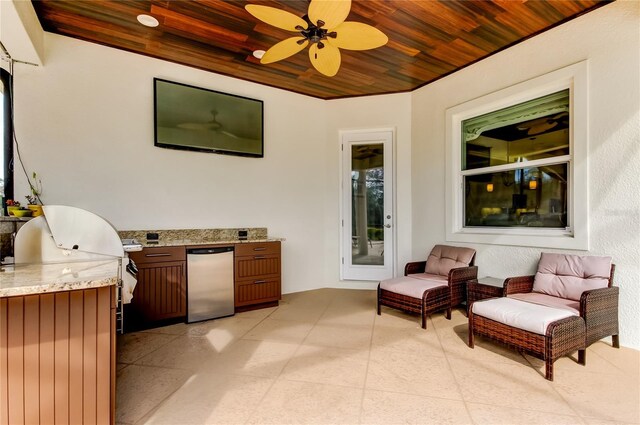 view of patio / terrace featuring outdoor lounge area, a grill, an outdoor kitchen, and a ceiling fan