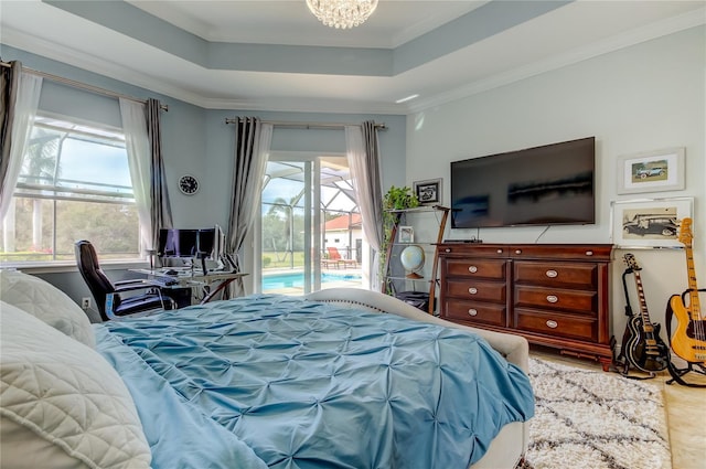 bedroom with ornamental molding, access to outside, a tray ceiling, and a notable chandelier