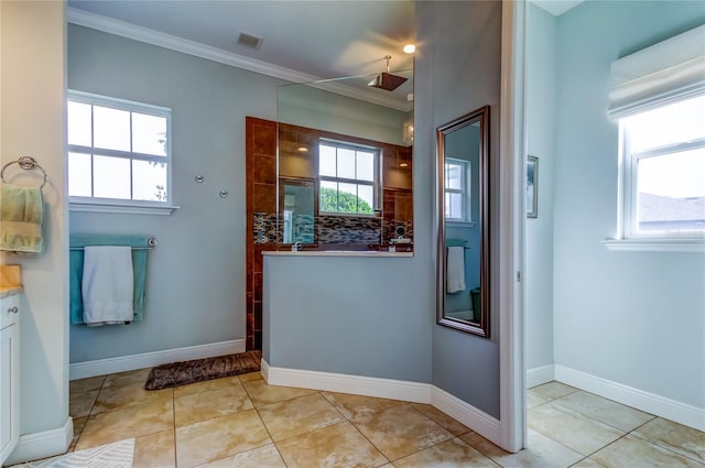 full bath with a walk in shower, ornamental molding, visible vents, and a healthy amount of sunlight