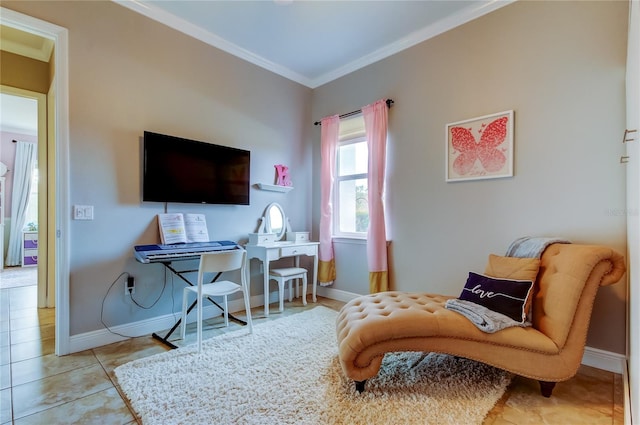 sitting room with tile patterned flooring, crown molding, and baseboards