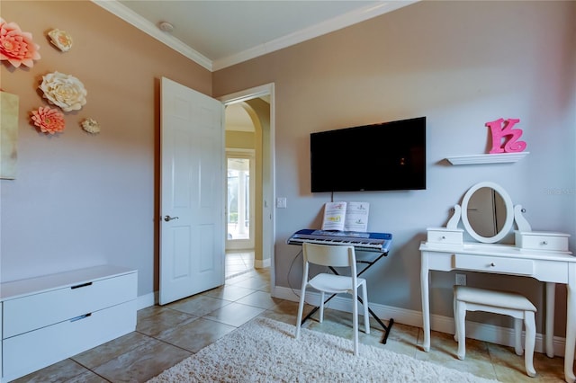 tiled home office featuring arched walkways, ornamental molding, and baseboards