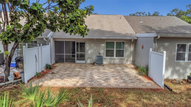 back of property featuring central AC unit and a patio area