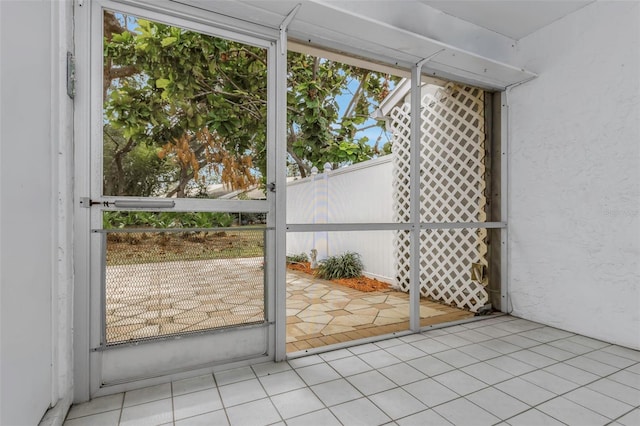 entryway with light tile patterned floors