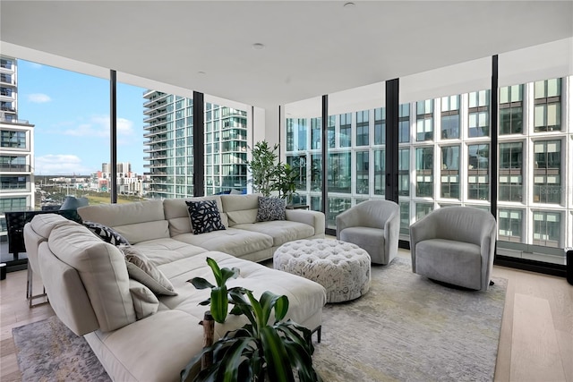 1000 Water St Unit 1002, Tampa, FL 33602 - living room with expansive windows and light wood-type flooring