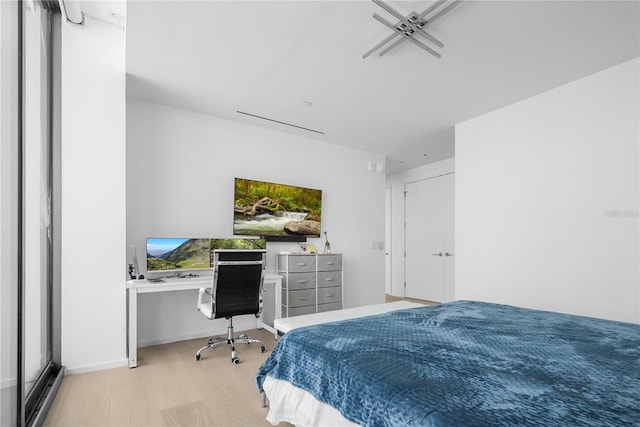 1000 Water St Unit 1002, Tampa, FL 33602 - bedroom with light wood-type flooring