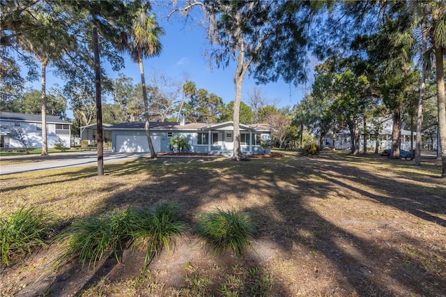 view of front of house featuring a garage and a porch