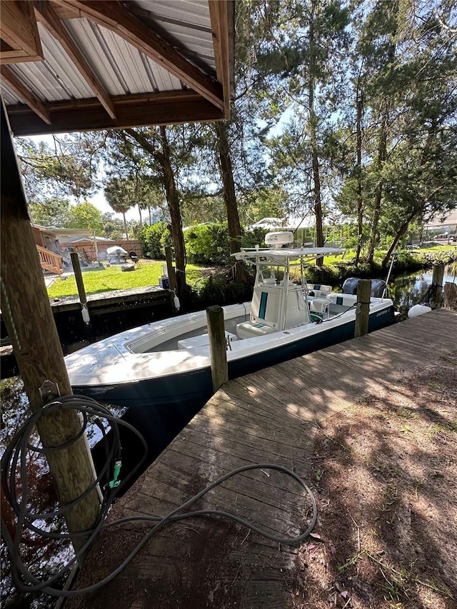 view of patio featuring a water view and a boat dock