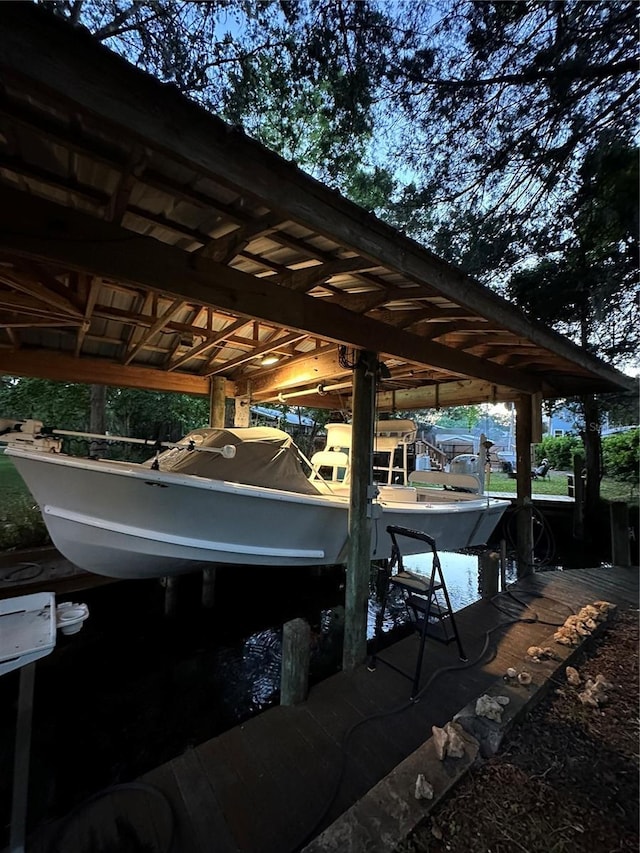 view of dock with boat lift