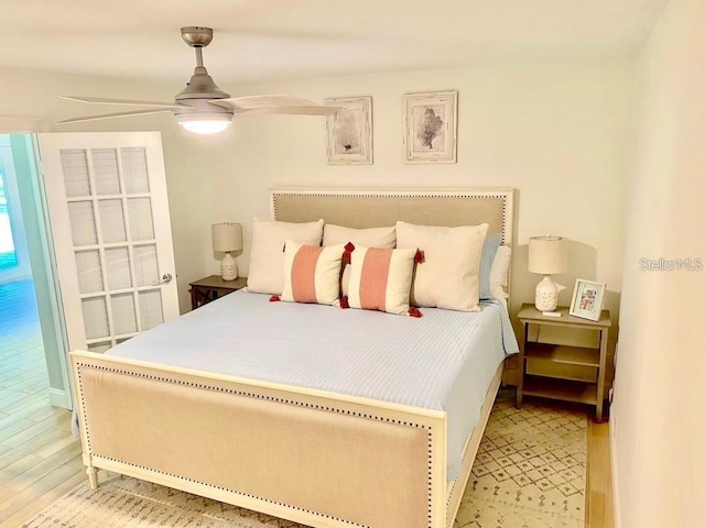 bedroom with ceiling fan and light wood-style floors