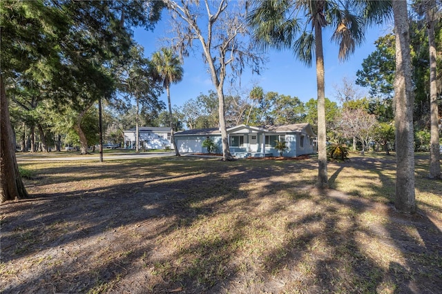 view of yard featuring a garage