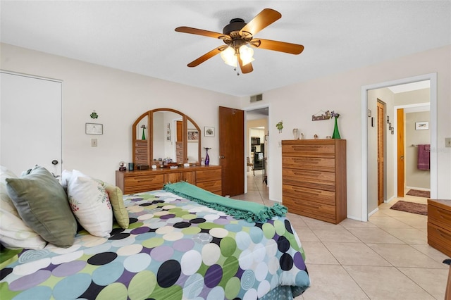 bedroom with light tile patterned flooring and ceiling fan
