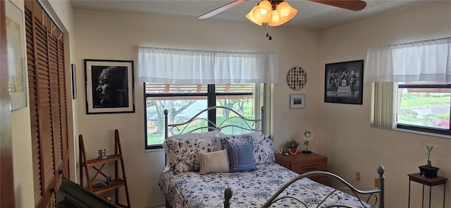 5849 Park St N Unit 201, Saint Petersburg, FL 33709 - bedroom featuring multiple windows and ceiling fan