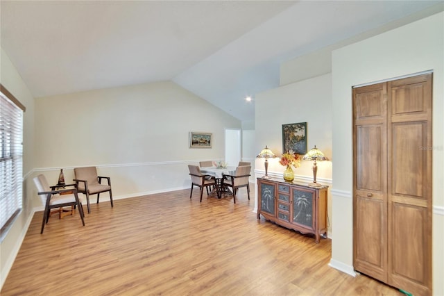 sitting room with lofted ceiling and light hardwood / wood-style flooring