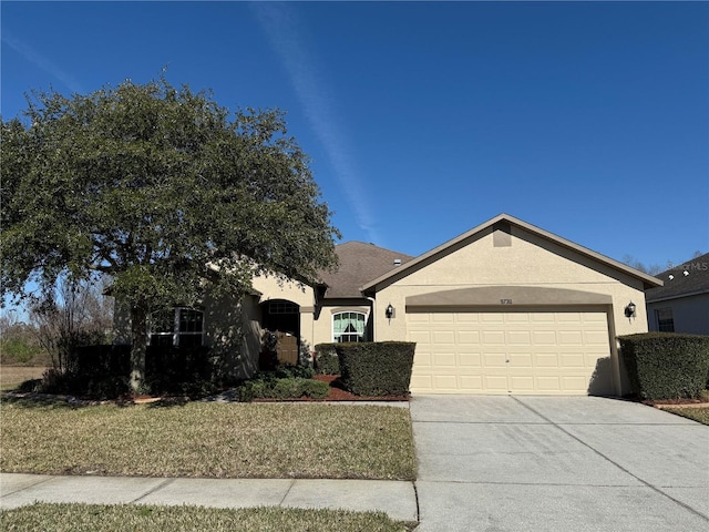 view of front of house with a garage and a front yard