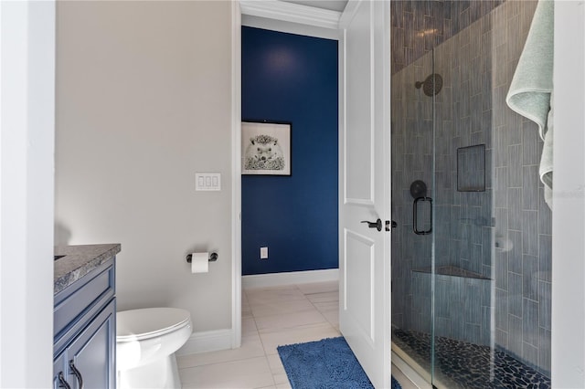 bathroom with a shower with door, tile patterned flooring, vanity, ornamental molding, and toilet