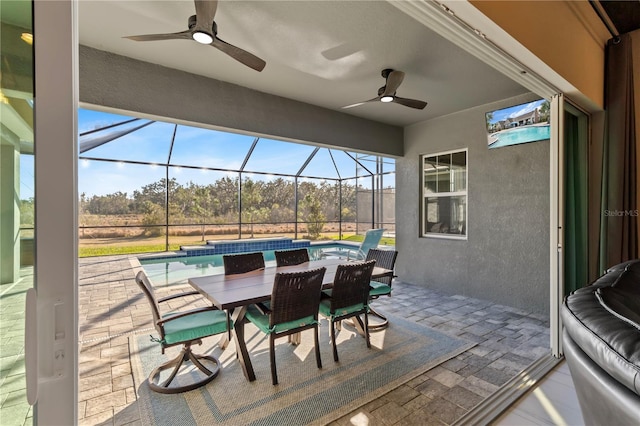 view of patio with a pool with hot tub, ceiling fan, and glass enclosure