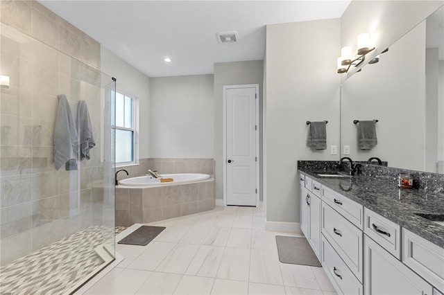 14215 Swiss Bridge Dr, Riverview, FL 33579 - full bath with a bath, double vanity, a shower stall, baseboards, and tile patterned flooring
