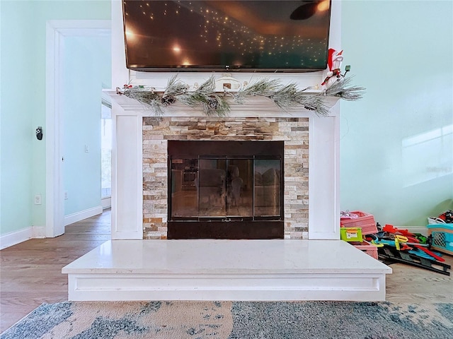 13653 Heritage Way, Sarasota, FL 34240 - details featuring hardwood / wood-style flooring and a fireplace