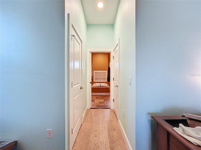13653 Heritage Way, Sarasota, FL 34240 - hall with light hardwood / wood-style flooring
