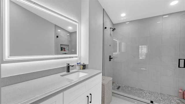 bathroom featuring vanity and walk in shower