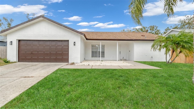 view of front facade with a garage and a front yard