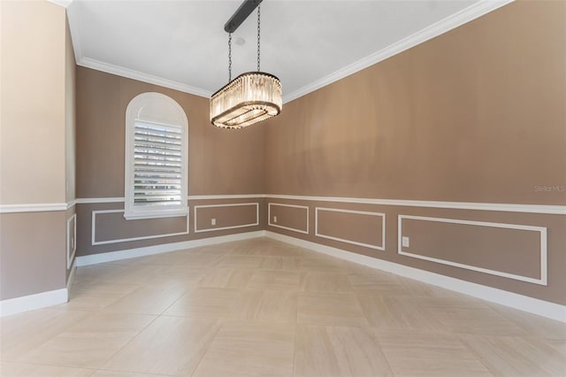 tiled spare room with ornamental molding and a chandelier