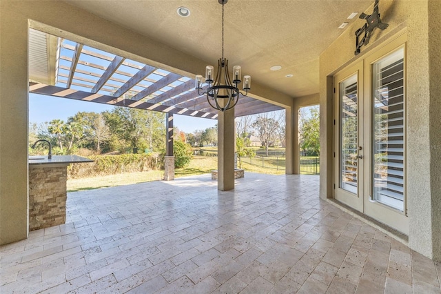 view of patio / terrace with a pergola and french doors