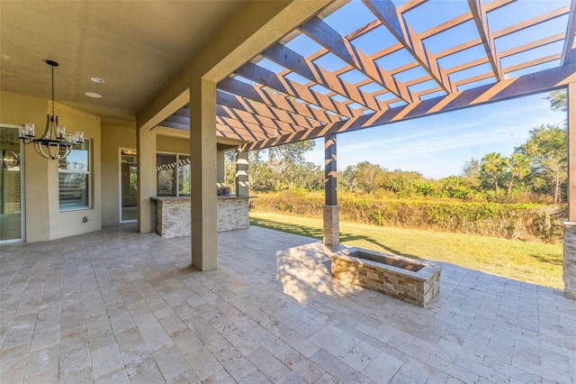 view of patio / terrace featuring an outdoor fire pit and a pergola