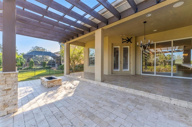 view of patio / terrace with ceiling fan, a pergola, and a fire pit